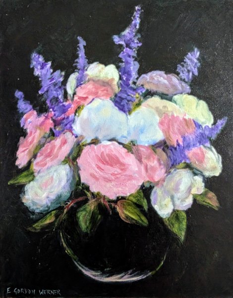 pink and white roses with purple salvia in a black vase